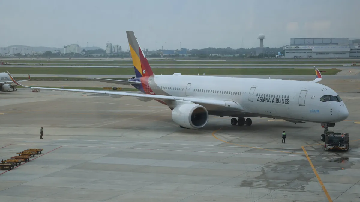 An Asiana Airlines Airbus A350-900 taxiing at Incheon International Airport, Asiana Airlines titles clear on the fuselage
